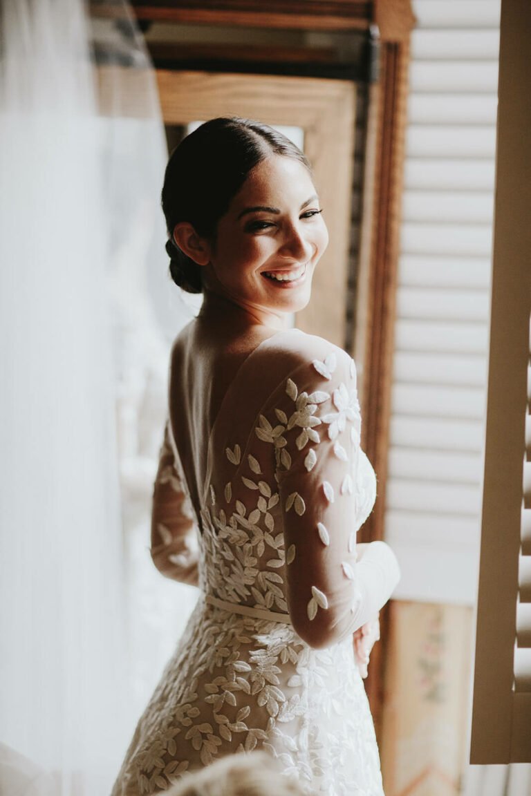 Taylor wearing custom Charla gown with sleeves