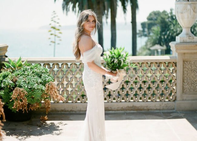 Mira bride wearing Chaz gown, draped sleeves & veil