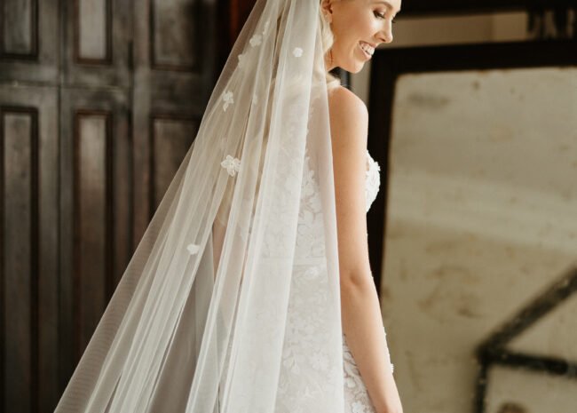 Kara Weigelt wearing Jona gown and matching veil