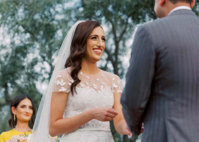 Mahsaw Motlagh wearing Charla gown, matching topper & matching veil