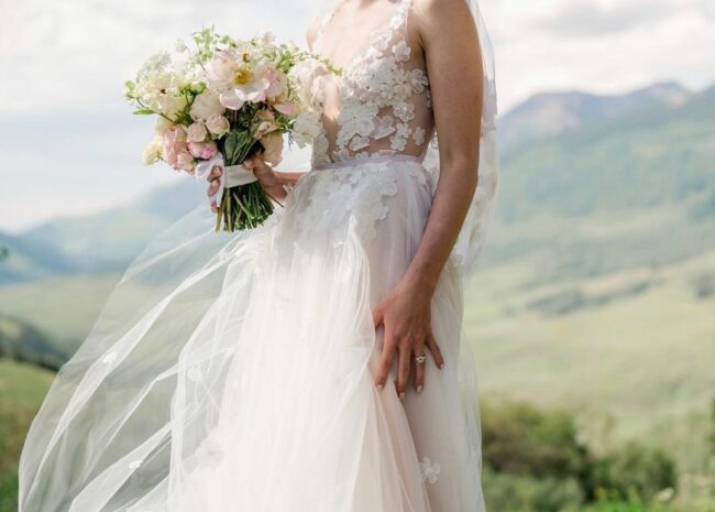 Lauren Mize wearing Ari gown and Ari veil